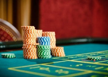 Live blackjack and roulette tables displayed on mobile phone screen
